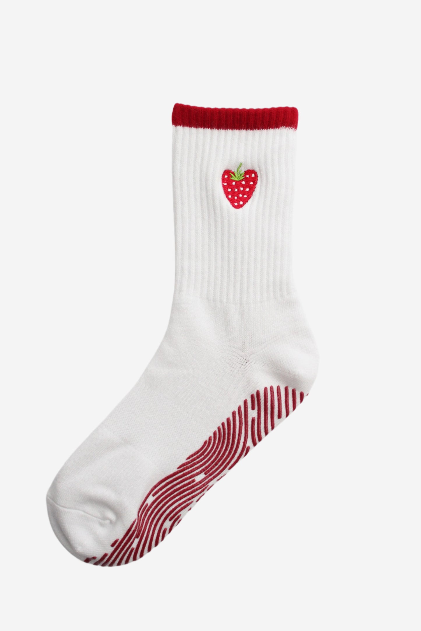 White sock with red strawberry design on a white background