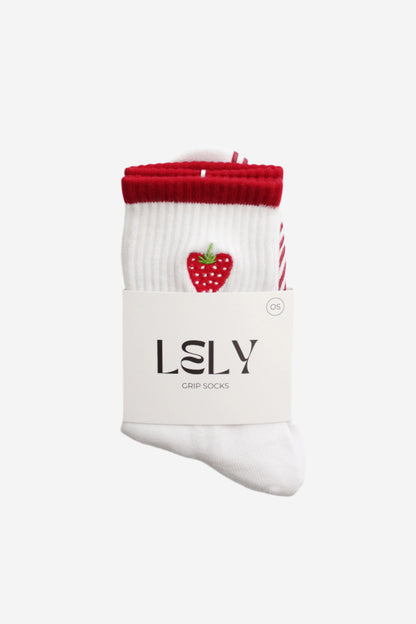 White socks with red top and strawberry design in packaging 