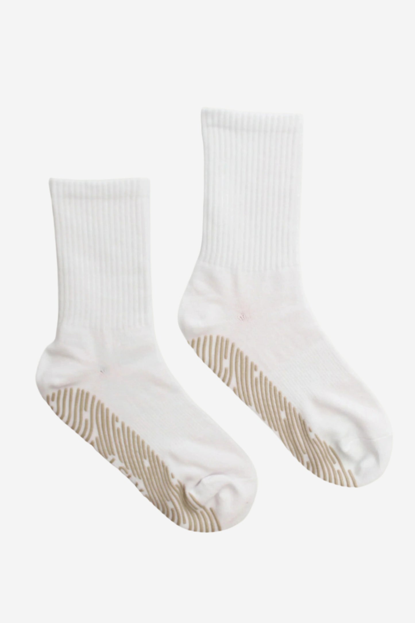 Pair of white crew socks with beige grips