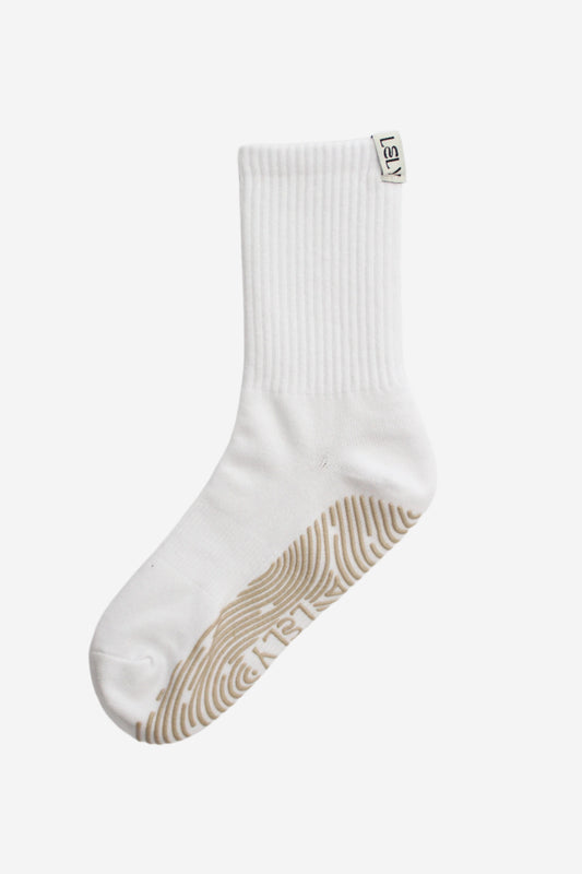 White ribbed crew sock with beige grips and LELY woven label