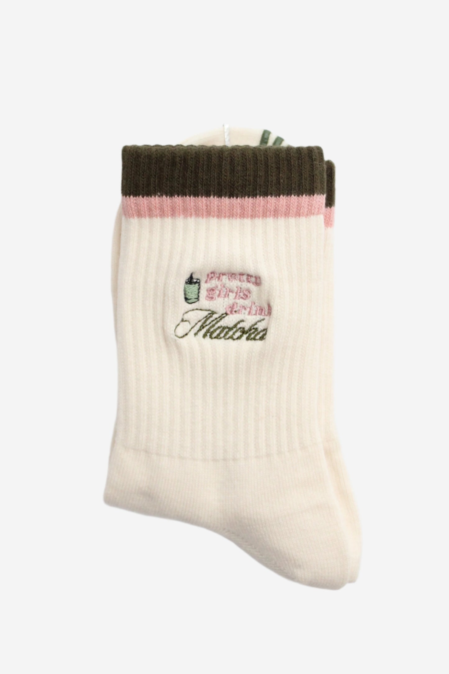 White sock with green top and pink middle section with pattern that says pretty girls drink matcha