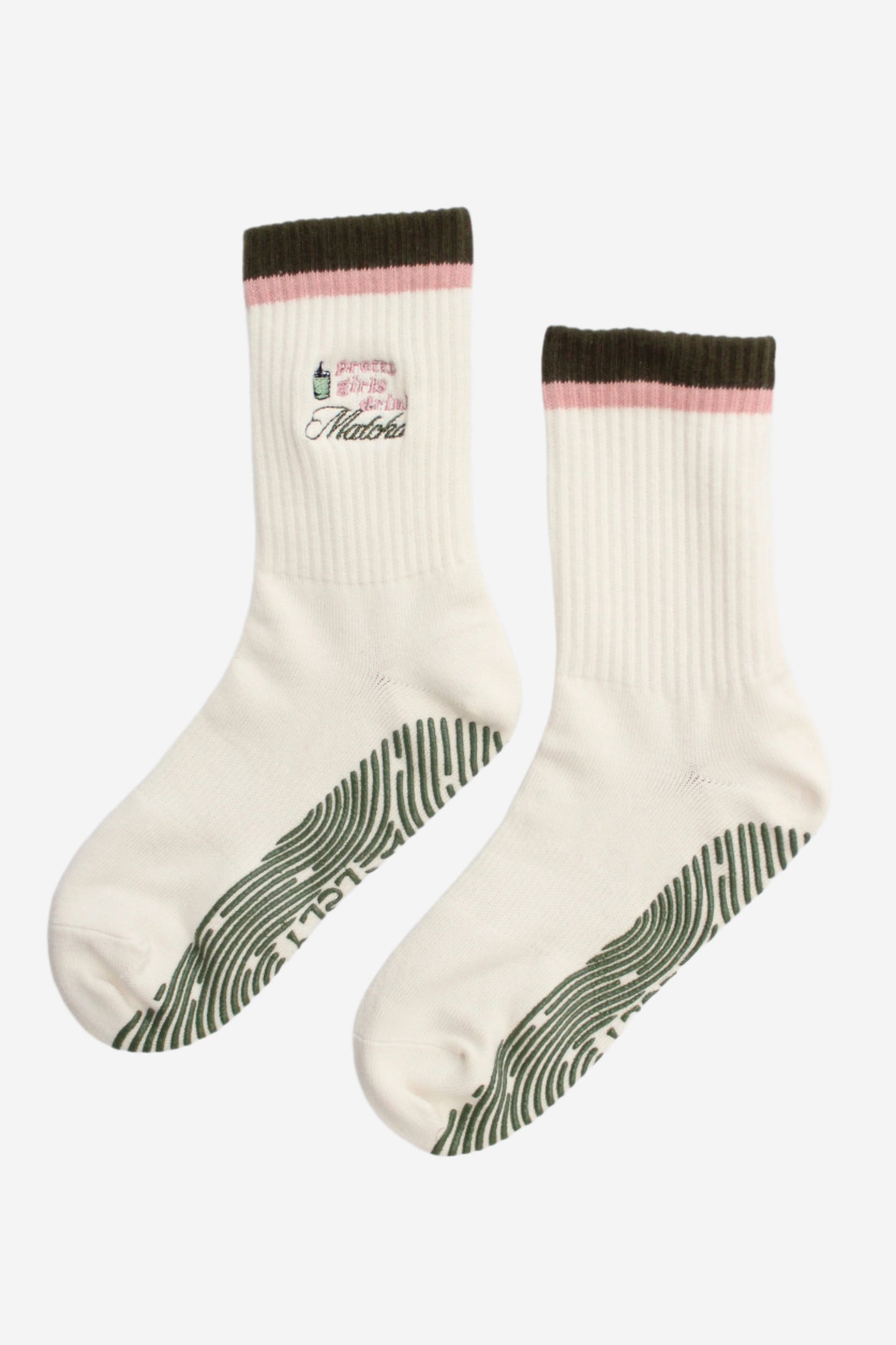 Pair of socks with green sole pattern, pink detail and pretty girls drink matcha pattern