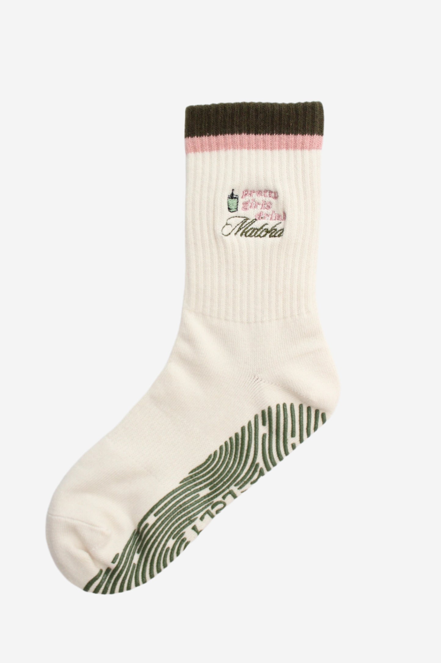 White sock with text that says Pretty Girls Drink Matcha and green sole grip