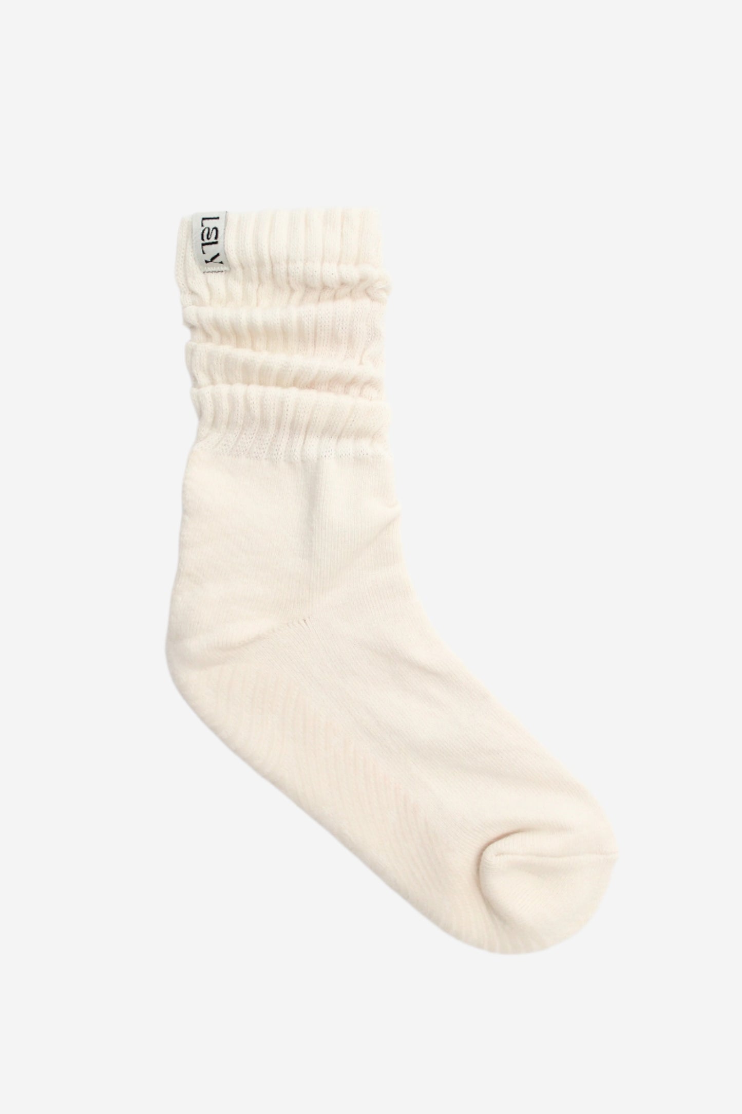 White slouch knit sock with a brand logo on woven label 