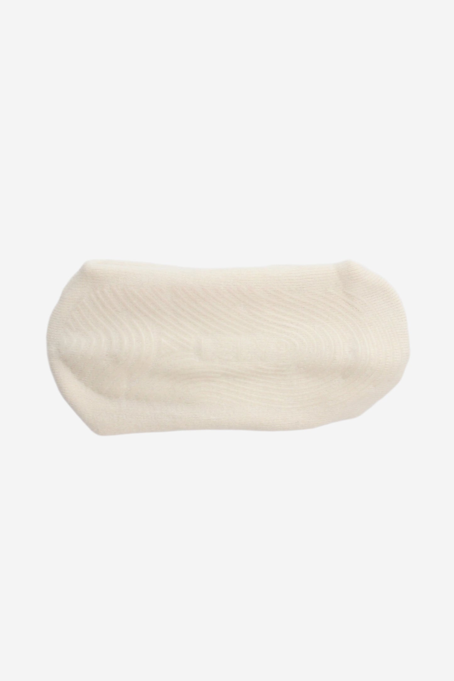 Sole of ivory sock with clear grips